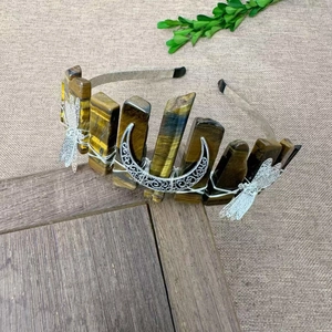 Close-up of handmade tiger eye stone headband with silver dragonfly and moon accents