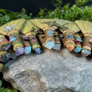 Handmade witch brooms with natural crystals and metal charms for Halloween decor