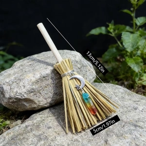 Mini witch broom charm with crystal and moon pendant on natural wood for Halloween decor