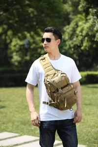 Macro shot of high-density khaki tactical chest bag with MOLLY system for hiking