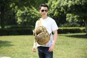 Detailed view of khaki tactical chest bag with Molle system on outdoor model