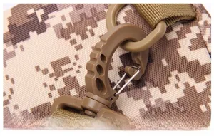 Detail of high-strength tactical plastic buckle and desert camouflage strap on chest bag