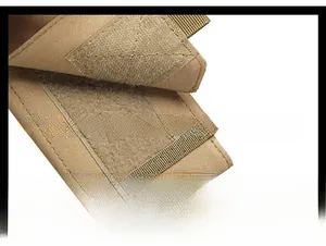 Close-up of tan tactical MOLLE pouch showing durable nylon fabric and velcro closure