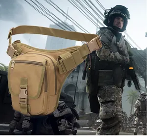 Close-up of khaki tactical leg bag with multiple pockets and MOLLE webbing system