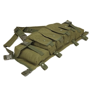 Army green tactical chest rig with MOLLE pouches and quick-release buckles in plain white background