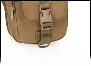 Tactical waist bag detail showing large plastic buckle closure and durable D-ring