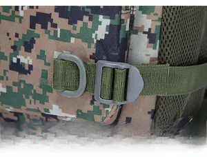 Macro shot of a durable grey D-ring attachment on nylon webbing of a camouflage backpack