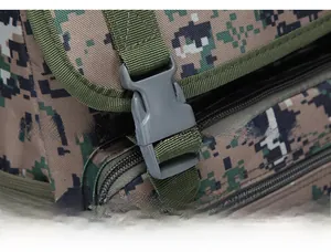 Close-up of durable gray tactical plastic buckle on camo outdoor backpack webbing