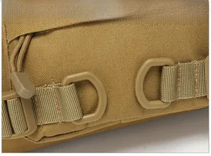 Close-up of tactical waist bag showing MOLLE system, D-rings and durable nylon fabric