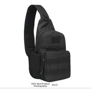 Detail of black tactical sling bag with MOLLE webbing and padded shoulder strap