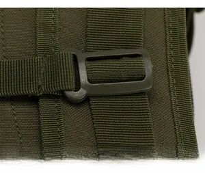 Detail view of the heavy-duty adjustable plastic buckle and nylon webbing on a tactical backpack