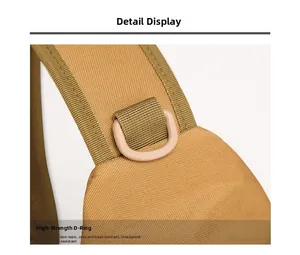Macro view of high-strength D-ring buckle on durable khaki nylon outdoor crossbody bag