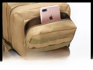 Front zipper pocket of khaki tactical backpack showing storage for a smartphone