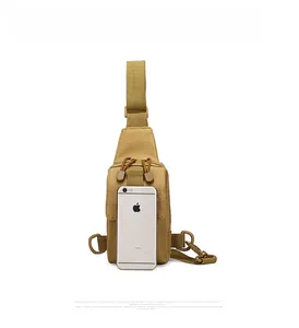 Tactical sling bag in khaki nylon shown with a smartphone for size comparison