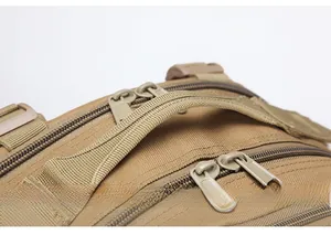 Close-up of thickened padded handle and precision stitching on tactical outdoor backpack
