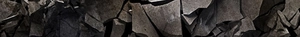 Close-up of durable black tactical material with a rugged cracked stone texture