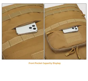Front zipper pocket of tactical backpack showing capacity with a smartphone inside