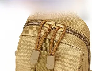 Detail shot of the high-density paracord zipper pull on a tactical shoulder bag