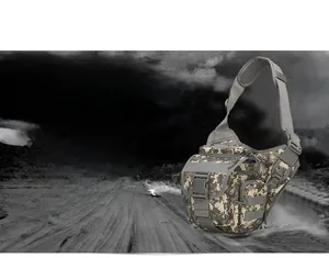 Detail view of digital camouflage tactical saddle bag with MOLLE webbing and buckles