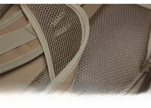 Detail of ergonomic breathable mesh shoulder straps on khaki tactical backpack