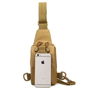 Tactical khaki sling bag made of durable nylon shown with a phone for size comparison