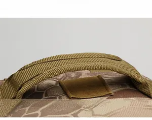 Close-up of the tactical backpack top handle with reinforced stitching and camo pattern