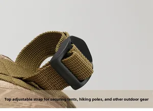 Top adjustable straps on tactical backpack for bundling tents and trekking poles