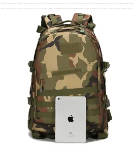 Tactical camouflage backpack size comparison shown next to an iPad mini tablet