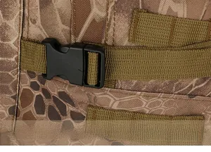 Detail of durable side buckle and adjustable webbing on camouflage tactical backpack