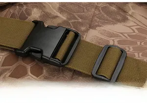 Detail view of durable black KAM buckle connected to tactical camo nylon webbing