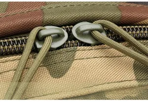Detail of durable paracord pullers and heavy duty zippers on camouflage tactical backpack