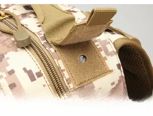 Close-up of tactical backpack hydration port with velcro flap in desert digital camo