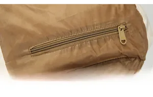 Close-up of the durable brown zipper system on the waterproof 50L tactical backpack