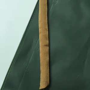 Detailed view of durable brown woven strap texture on a green professional cutting mat