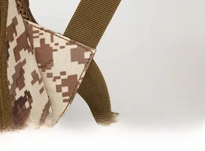 Detail of desert digital camo backpack with reinforced triangular shoulder strap stitching