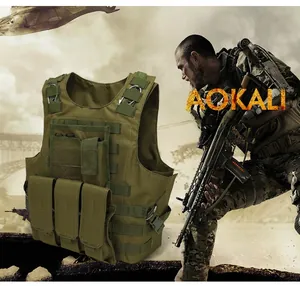 Close-up of military tactical vest with MOLLE system and three mag pouches in olive green