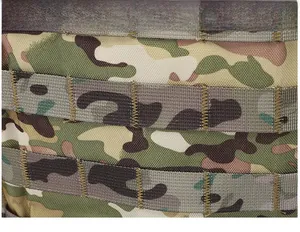 Macro view of camouflage tactical vest featuring heavy-duty MOLLE system webbing