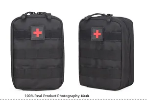 Detail of black tactical medical pouch with red cross patch and MOLLE system straps