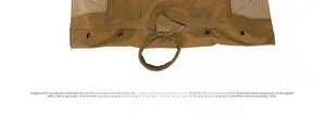Detail of coyote brown tactical vest with drainage grommets and reinforced velcro strap