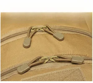 Detail view of durable paracord zipper pulls on a high-density tactical outdoor backpack
