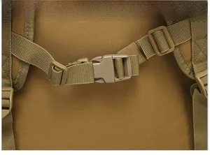 Detail view of durable khaki tactical backpack featuring custom quick-release plastic buckles
