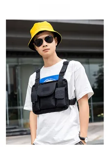 Outdoor model wearing black tactical chest bag with adjustable nylon straps and pockets