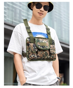 Detail of tactical camouflage chest bag with adjustable straps and multi-pocket structure