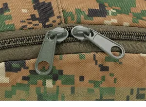 Macro detail of camouflage tactical backpack featuring durable heavy duty dual metal zippers