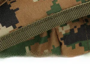 Close-up of reinforced stitching and durable camouflage fabric on tactical backpack straps
