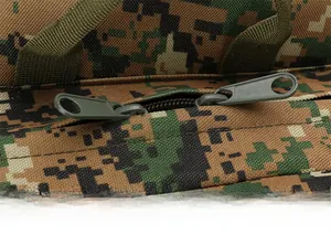 Close-up of waterproof fabric and hidden dual zippers on camouflage tactical backpack