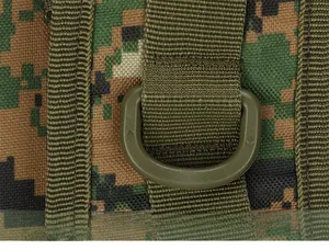 Detail of durable digital camo fabric with tactical nylon webbing and D-ring hook