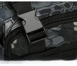 Macro detail of high-strength plastic buckle and waterproof camo nylon fabric on tactical bag
