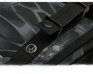 Detail of durable grey honeycomb camo fabric with metallic tactical expansion buckle