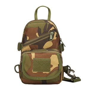 Detailed view of woodland camo tactical chest bag with velcro panel and nylon texture